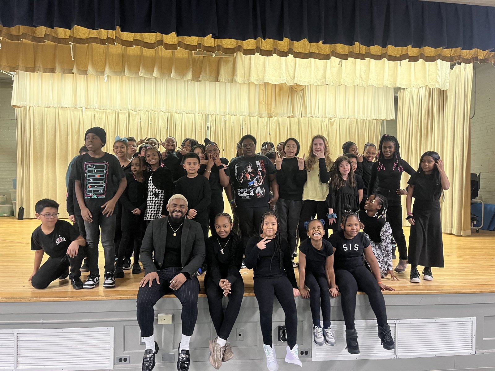 Mal Best with a youth choir on stage